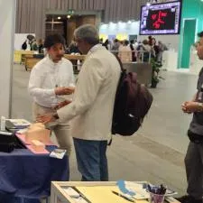 Customer photo from Laura of our Cubano Pen - Opaque, a man standing next to a man with a backpack