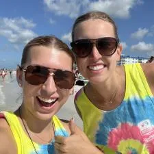 Customer photo from Chip of our Zone Performance 1/4-Zip Pullover - Men's - Full Color, two women wearing sunglasses and smiling at the camera