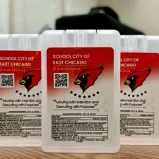 Customer photo from Emily of our Credit Card Spray Sanitizer, a group of plastic containers with red and white labels
