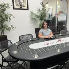 Customer photo from Scott of our Micro Mesh UV Performance Polo - Ladies' - Embroidered, a woman sitting at a poker table