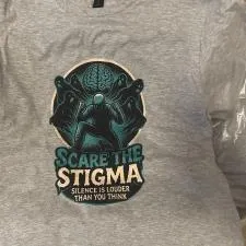 Customer photo from Josph of our Gildan Softstyle T-Shirt - Men's - Full Color, a grey shirt with a picture of a person on it