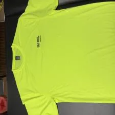 Customer photo from Michael of our Boston Training Tech Tee - Men's, a yellow shirt on a black surface