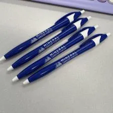 Customer photo from Brooke of our Javelin Pen, a group of blue pens next to a keyboard