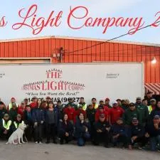Customer photo from Cori of our Elite Cap - Embroidered, a group of people posing for a photo