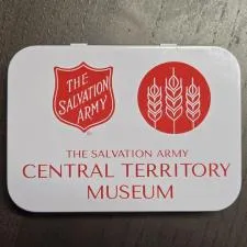 Customer photo from Nanci of our Metal Tin First Aid Kit - 24 hr, a white rectangular object with red text and symbols on it