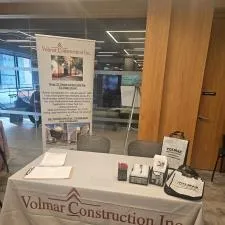Customer photo from Vicky of our Ideal Retractable Banner Display - 33-1/2", a table with a white tablecloth and a sign