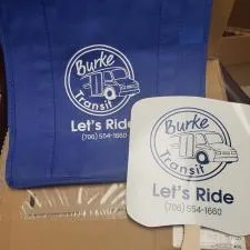 Customer photo from Christine of our Hand Fan - Slice, a blue and white fan next to a brown box