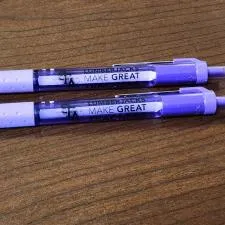 Customer photo from Shunta of our Paper Mate InkJoy Pen - Translucent - 24 hr, two purple pens on a wood surface