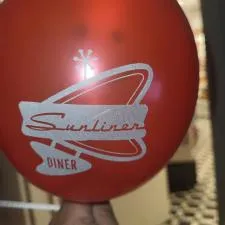 Customer photo from Jennifer of our Balloon - 9" Metallic Colors, a hand holding a red balloon