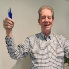 Customer photo from Karen of our Hocus Pocus Slim Pen - Translucent, a man holding up two blue guns