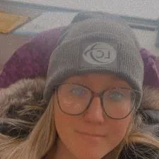 Customer photo from Gabrielle of our Five Panel Poly Rope Cap - Embroidered, a woman wearing glasses and a hat
