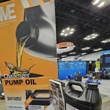 Customer photo from Jordan of our EuroFit Banner Stand - 7-1/2' x 3', a black container with liquid pouring out of it