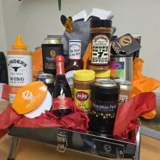 Customer photo from Laura of our Stainless BBQ Grill, a gift basket with various drinks and condiments
