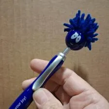 Customer photo from Kristal of our Emoji MopTopper Pen, a hand holding a pen