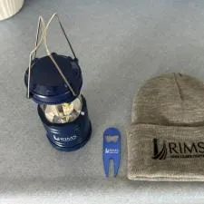 Customer photo from GREGORY of our Divot Bottle Opener Tool, a hat and lantern with a bottle opener