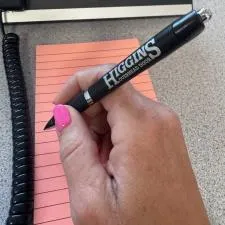 Customer photo from Robin of our Target Pen - Rose Gold, a hand holding a pen