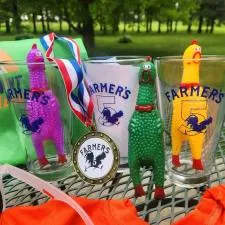 Customer photo from Amy of our Sardinia Pint Glass - 16 oz, a group of glasses with a medal and a medal on a table